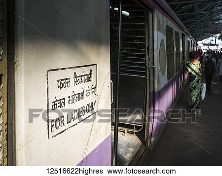 Stock Photograph - Sign on a train's passenger car saying 'for ladies only'; Mumbai, Maharashtra, India. Fotosearch