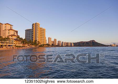 Skyline view of Waikiki Beach and Diamond Head Crater viewed from the ocean; Honolulu, Oahu, Hawaii, United States of America View Large Photo Image Stock Photograph - Skyline view of Waikiki Beach and Diamond Head Crater viewed from the ocean; Honolulu, Oahu, Hawaii, United States of America. Fotosearch