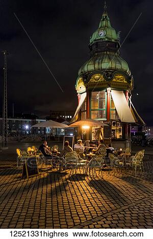 Small cafe in town square at night; Copenhagen, Denmark View Large Photo Image Stock Photograph - Small cafe in town square at night; Copenhagen, Denmark. Fotosearch