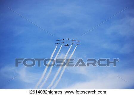 Stock Photograph - Snowbirds flying in formation at the Toronto Airshow 2017; Toronto, Ontario, Canada. Fotosearch