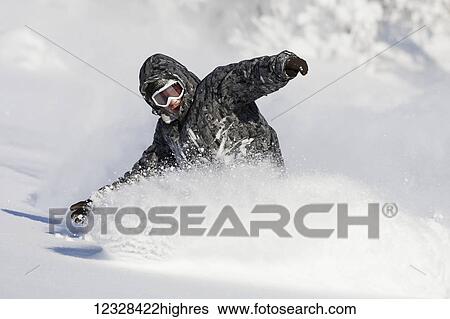 Snowboarder in deep snow, Homer, Southcentral Alaska, USA View Large Photo Image Stock Photograph - Snowboarder in deep snow, Homer, Southcentral Alaska, USA. Fotosearch