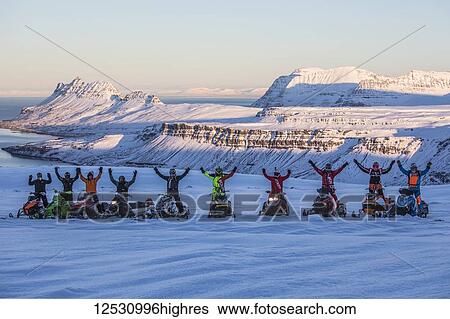 Snowmobilers having fun in the mountains surrounding Djupavik; Djupavik, West Fjords; Iceland View Large Photo Image Stock Photograph - Snowmobilers having fun in the mountains surrounding Djupavik; Djupavik, West Fjords; Iceland. Fotosearch