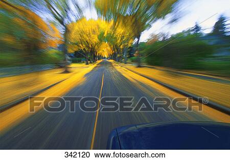 Speeding down a road in autumn View Large Photo Image Stock Image - Speeding down a road in autumn. Fotosearch