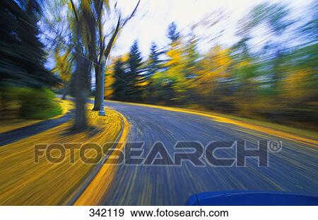 Speeding down a winding road in autumn View Large Photo Image Stock Photo - Speeding down a winding road in autumn. Fotosearch