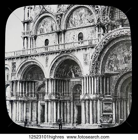 Stock Photograph - St. Mark's Cathedral, Venice circa 1900 on a magic lantern slide, photographs created in 1888 by Joseph John William. Details of the decorative facade of the left side of the building; Venice, Italy. Fotosearch