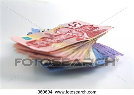 Picture - Stack of Canadian money. Fotosearch