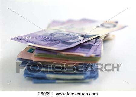 Stock Image - Stack of Canadian money. Fotosearch