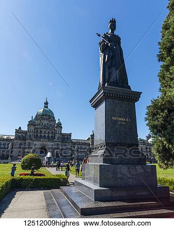 Stock Photograph - Statue of Queen Victoria and the British Columbia Parliament Buildings in Victoria, Vancouver Island; Victoria, British Columbia, Canada. Fotosearch