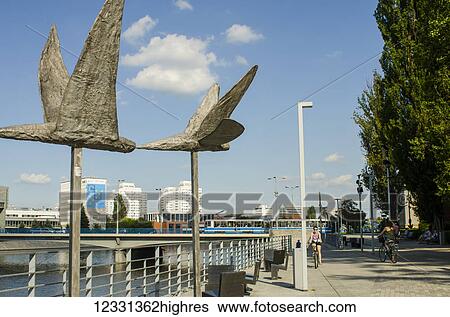 Stock Photograph - Steel Bird Sculptures On Dunikowskiego Boulevard Along River Odra; Wroclaw, Poland. Fotosearch