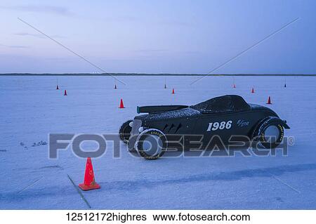 Stock Photograph - Street Roadster Class E/STR, a 1934 Ford Roadster with 256 Dart V-8 at dawn staging on starting line before try for 214. 202 mph record on Bonneville Salt Flats during Bonneville Speed Week 2017; Wendover, Utah, United States of America. Fotosearch