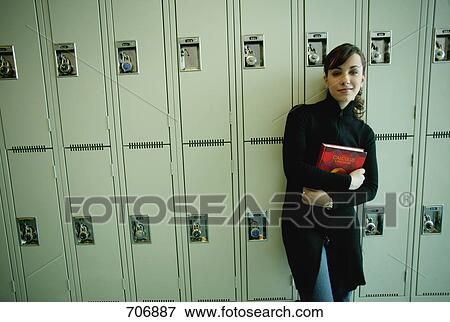Student hangs out by lockers View Large Photo Image Stock Photo - Student hangs out by lockers. Fotosearch