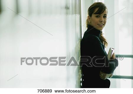 Student hangs out in hallway View Large Photo Image Stock Photo - Student hangs out in hallway. Fotosearch