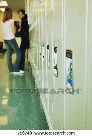 Stock Photo - Students against lockers. Fotosearch