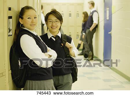 Students standing by lockers View Large Photo Image Stock Image - Students standing by lockers. Fotosearch