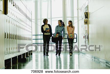Stock Photo - Students walking in hallway. Fotosearch