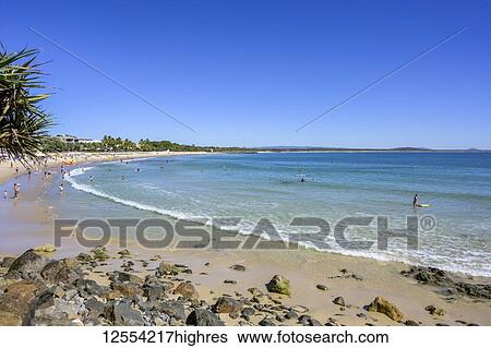 Stock Photograph - Sunbathers and swimmers at the beach, Sunshine Coast; Noosa Heads, Queensland, Australia. Fotosearch