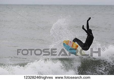 Surfer Falling From Surfboard In The Waters Near Yakutat, Southeast Alaska, USA View Large Photo Image Stock Photograph - Surfer Falling From Surfboard In The Waters Near Yakutat, Southeast Alaska, USA. Fotosearch