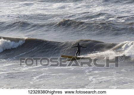 Stock Photograph - Surfer In The Waters Of Kachemak Bay, Homer, Southcentral Alaska, USA. Fotosearch