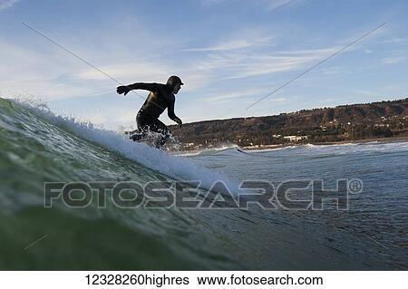 Surfer Riding A Wave Near Homer, Southcentral Alaska, USA View Large Photo Image Stock Photograph - Surfer Riding A Wave Near Homer, Southcentral Alaska, USA. Fotosearch