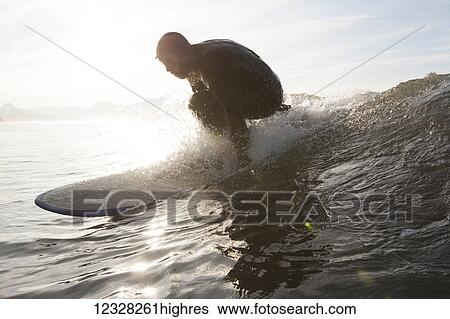 Surfer Riding A Wave Near Homer, Southcentral Alaska, USA View Large Photo Image Stock Photograph - Surfer Riding A Wave Near Homer, Southcentral Alaska, USA. Fotosearch