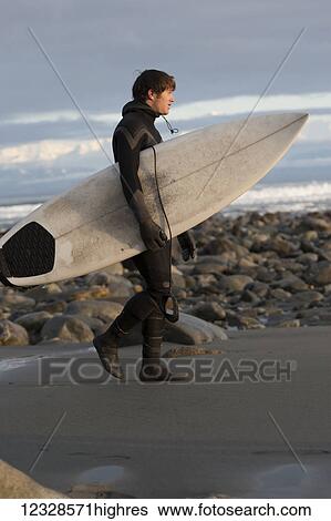 Surfer with his board on the beach, Southeast Alaska; Yakutat, Alaska, United States of America View Large Photo Image Stock Photograph - Surfer with his board on the beach, Southeast Alaska; Yakutat, Alaska, United States of America. Fotosearch