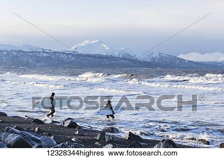 Surfers Entering Kachemak Bay Along Homer Spit, Southcentral Alaska, USA View Large Photo Image Stock Photograph - Surfers Entering Kachemak Bay Along Homer Spit, Southcentral Alaska, USA. Fotosearch