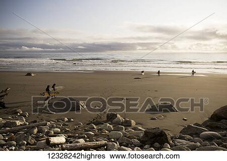 Stock Photograph - Surfers On The Beach Near Yakutat, Southeast Alaska, USA. Fotosearch