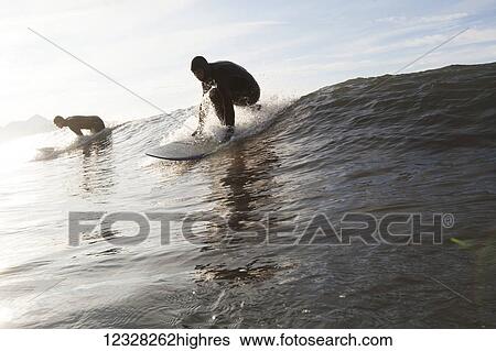 Surfers Riding A Wave Near Homer, Southcentral Alaska, USA View Large Photo Image Stock Photograph - Surfers Riding A Wave Near Homer, Southcentral Alaska, USA. Fotosearch