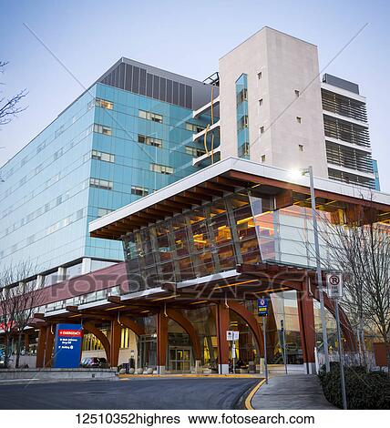 Stock Photograph - Surrey Memorial Hospital entrance and sign for emergency; Surrey, British Columbia, Canada. Fotosearch