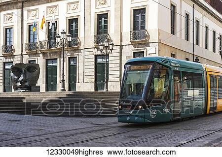 Teatro Guimera With Tranvia (Tram) Passing; Santa Cruz, Tenerife, Canary Islands, Spain View Large Photo Image Stock Photograph - Teatro Guimera With Tranvia (Tram) Passing; Santa Cruz, Tenerife, Canary Islands, Spain. Fotosearch