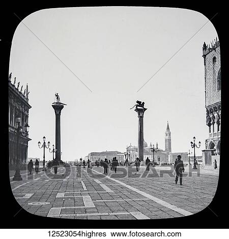 Stock Photograph - The beauties of Venice, circa 1900 on a magic lantern slide, photographs created in 1888 by Joseph John William. Small Piazza leading to the lagune with two famous granite columns brought by Doge Micheli from Syria in 1120, and erected here in 1180..... Fotosearch
