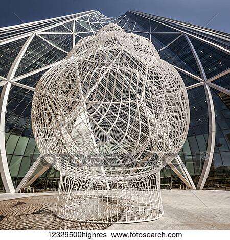 Stock Photograph - The Bow Building And Wonderland Sculpture; Calgary, Alberta, Canada. Fotosearch