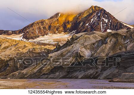 The eastern peak of Trident Volcano rises above the ash-covered Knife Creek Glaciers at sunset in Katmai National Park; Alaska, United States of America View Large Photo Image Stock Photograph - The eastern peak of Trident Volcano rises above the ash-covered Knife Creek Glaciers at sunset in Katmai National Park; Alaska, United States of America. Fotosearch