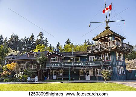 Stock Photograph - The heritage site tourist attraction Union Steamship Building in Snug Cove, Bowen Island welcoming tourists as they come off the ferry from Vancouver to the island; Bowen Island, British Columbia, Canada. Fotosearch