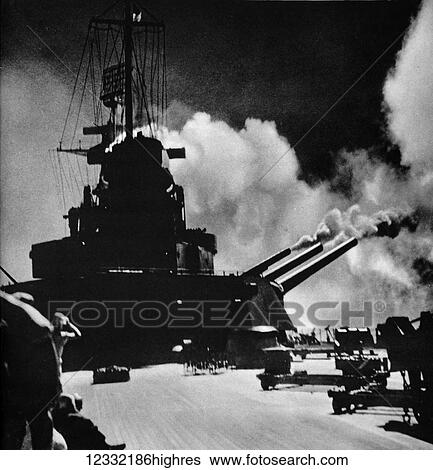 Stock Photograph - The Illustrated London News 1941. World war II. A salvo being fired from the aft turret of the North Carolina.. Fotosearch