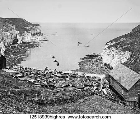Stock Photograph - The photograph is the work of G. W. Wilson photographer and slide manufacturer 1823-1893. North Bay Flamborough Head, Fishing was first recorded in the 13th century, when about nine boats fished the seas off the Head. By the 1890s, some eighty cobles.... Fotosearch