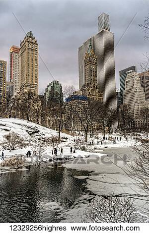 The Pond Partially Frozen After A Snowstorm, In Central Park; New York City, New York, United States Of America View Large Photo Image Stock Photograph - The Pond Partially Frozen After A Snowstorm, In Central Park; New York City, New York, United States Of America. Fotosearch