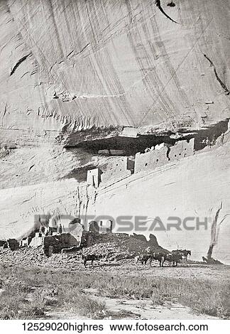 Stock Photograph - The ruins of the cliff dwellings of the Navajo people at the Canyon de Chelly, Arizona, United States of America, seen here c. 1911. From The Wonders of the World, published c. 1911.. Fotosearch