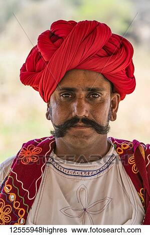 Stock Photograph - The traditional head wear and clothing by the men in the Jawai region of Northern India; Rajasthan, India. Fotosearch