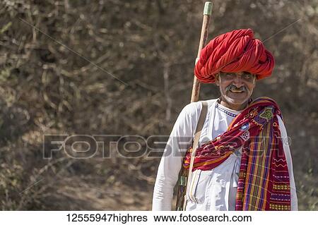 Stock Photograph - The traditional headwear and clothing by the men in the Jawai region of Northern India; Rajasthan, India. Fotosearch