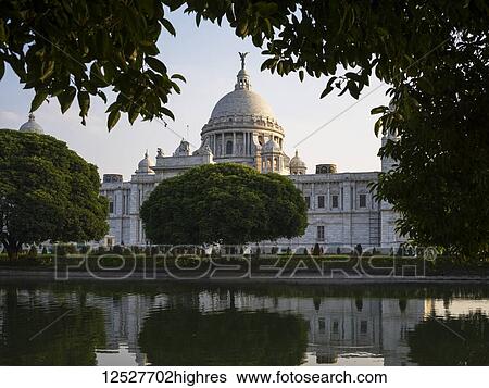 Stock Photograph - The Victoria Memorial, dedicated to the memory of Queen Victoria; Kolkata, West Bengal, India. Fotosearch