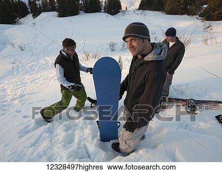 Three snowboarders standing on a snowy slope, South-Central Alaska; Homer, Alaska, United States of America View Large Photo Image Stock Photograph - Three snowboarders standing on a snowy slope, South-Central Alaska; Homer, Alaska, United States of America. Fotosearch