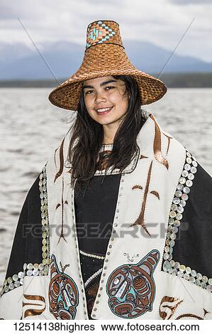 Stock Photograph - Tlingit first nation woman in traditional wardrobe on the shores of Teslin Lake; Teslin, Yukon, Canada. Fotosearch
