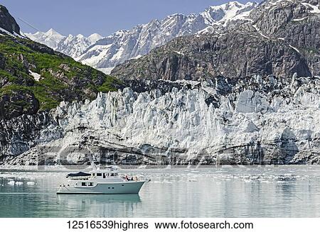 Stock Photograph - Tour boat in front of Margerie Glacier, Tarr Inlet, Glacier Bay National Park and Preserve, Southeast Alaska; Alaska, United States of America. Fotosearch