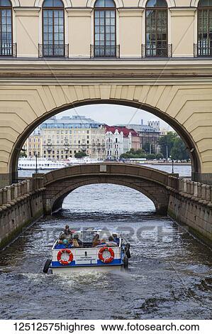 Stock Photograph - Tour boat on the Moyka River canal; St. Petersburg, Russia. Fotosearch