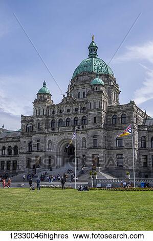 Stock Photograph - Tourists And Locals Gather On The Parliament Grounds; Victoria, British Columbia, Canada. Fotosearch