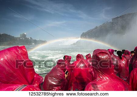 Tourists on a boat wearing red ponchos and viewing Niagara Falls; Niagara Fall, Ontario, Canada View Large Photo Image Stock Photograph - Tourists on a boat wearing red ponchos and viewing Niagara Falls; Niagara Fall, Ontario, Canada. Fotosearch
