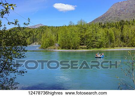 Stock Photograph - Tourists on a float trip on the Kenai River near Cooper Landing in Kenai Peninsula; Alaska, United States of America. Fotosearch