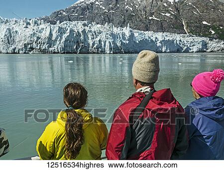 Stock Photograph - Tourists on board the Baranof Wind sightseeing at Margerie Glacier, Tarr Inlet, Glacier Bay National Park and Preserve, Southeast Alaska; Alaska, United States of America. Fotosearch