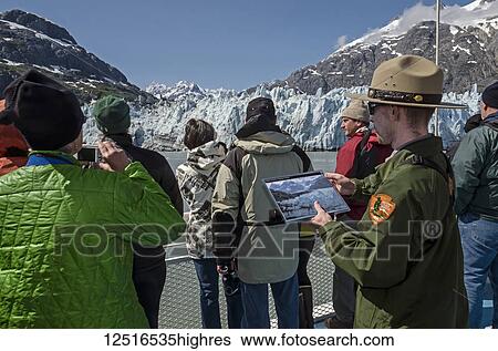 Stock Photograph - Tourists on board the Baranof Wind sightseeing at Margerie Glacier, Tarr Inlet, Glacier Bay National Park and Preserve, Southeast Alaska; Alaska, United States of America. Fotosearch